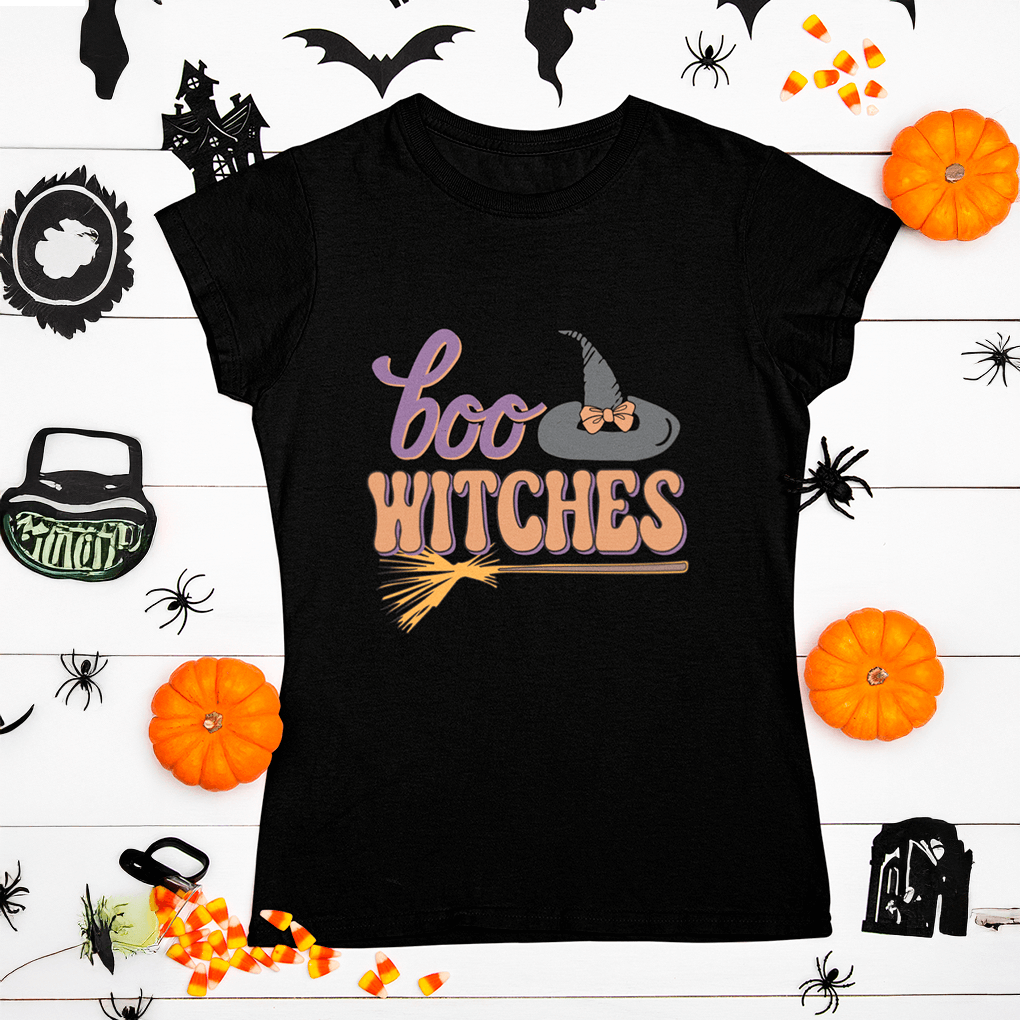 Black t-shirt with 'boo witches' design on a Halloween-themed background
