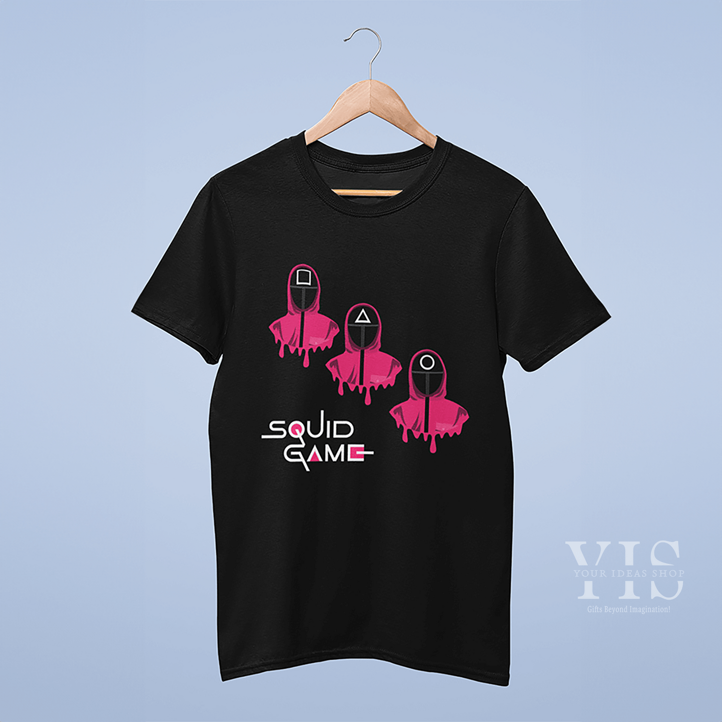 A stylish black T-shirt showcasing three guards in pink hooded uniforms. The graphic includes dripping effects and geometric shapes on the masks, along with the 'Squid Game' logo for a standout design. Ideal for casual and fan-inspired wear. Made by Your iDeas Shop