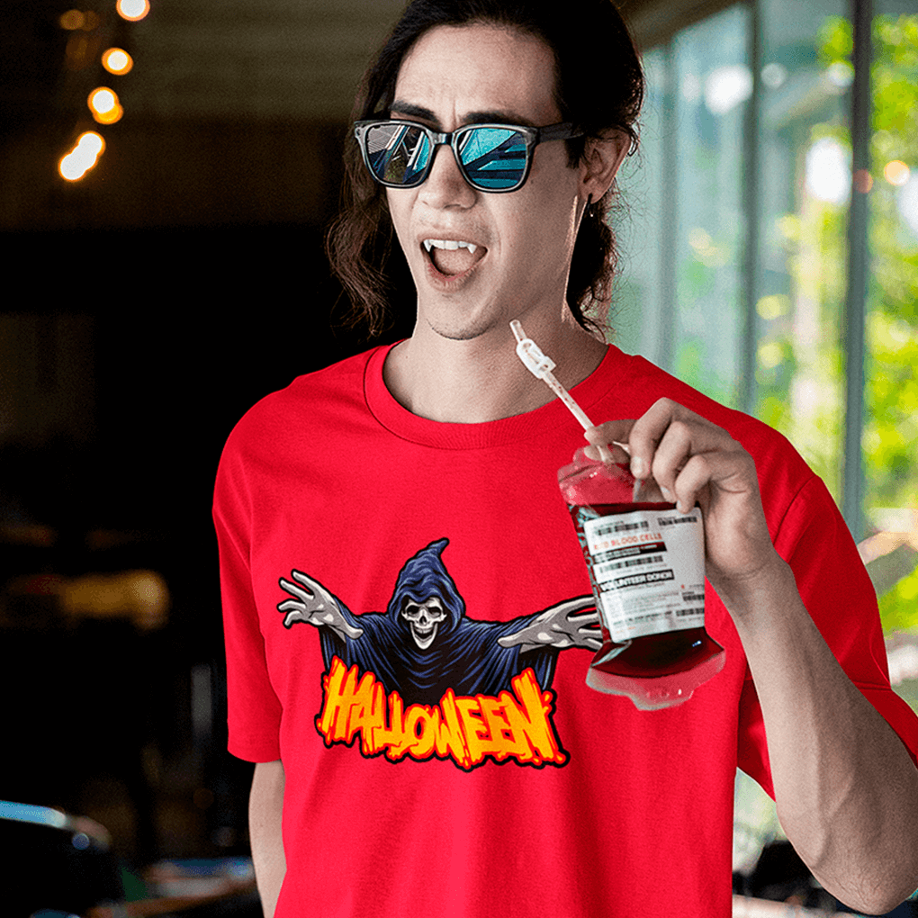 Person wearing a red 'Halloween' t-shirt holding a drink with a straw.