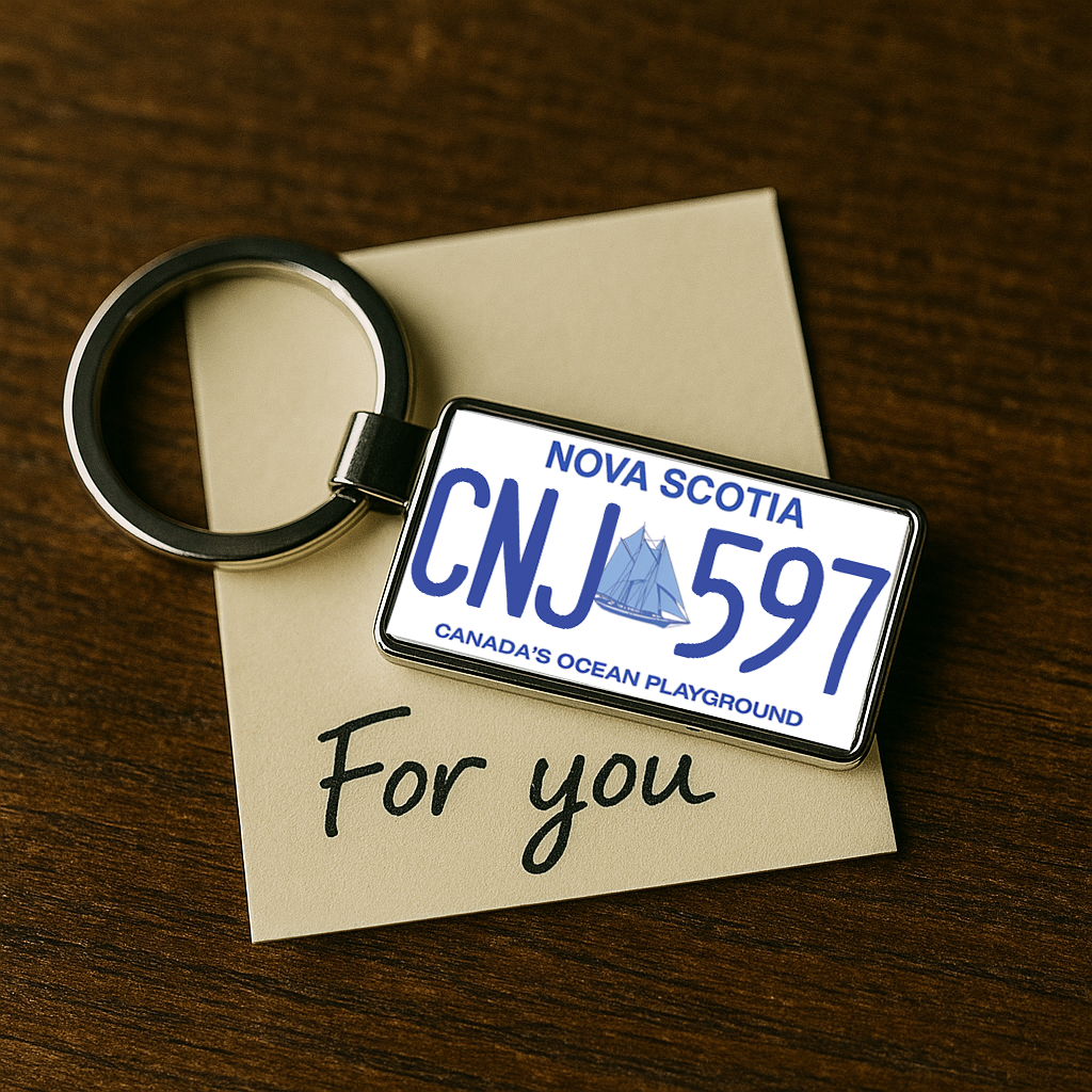A rectangular keychain featuring a Nova Scotia license plate design with CNJ 597, resting on a beige card that says 'For you' on a wooden surface. A thoughtful gift for travelers and car lovers. Made by Your iDeas Shop.