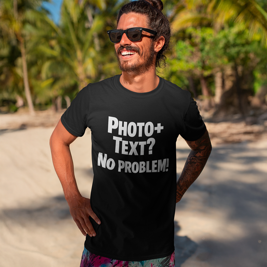 Man wearing a black t-shirt with 'PHOTO+ TEXT? NO PROBLEM!' text on a beach.