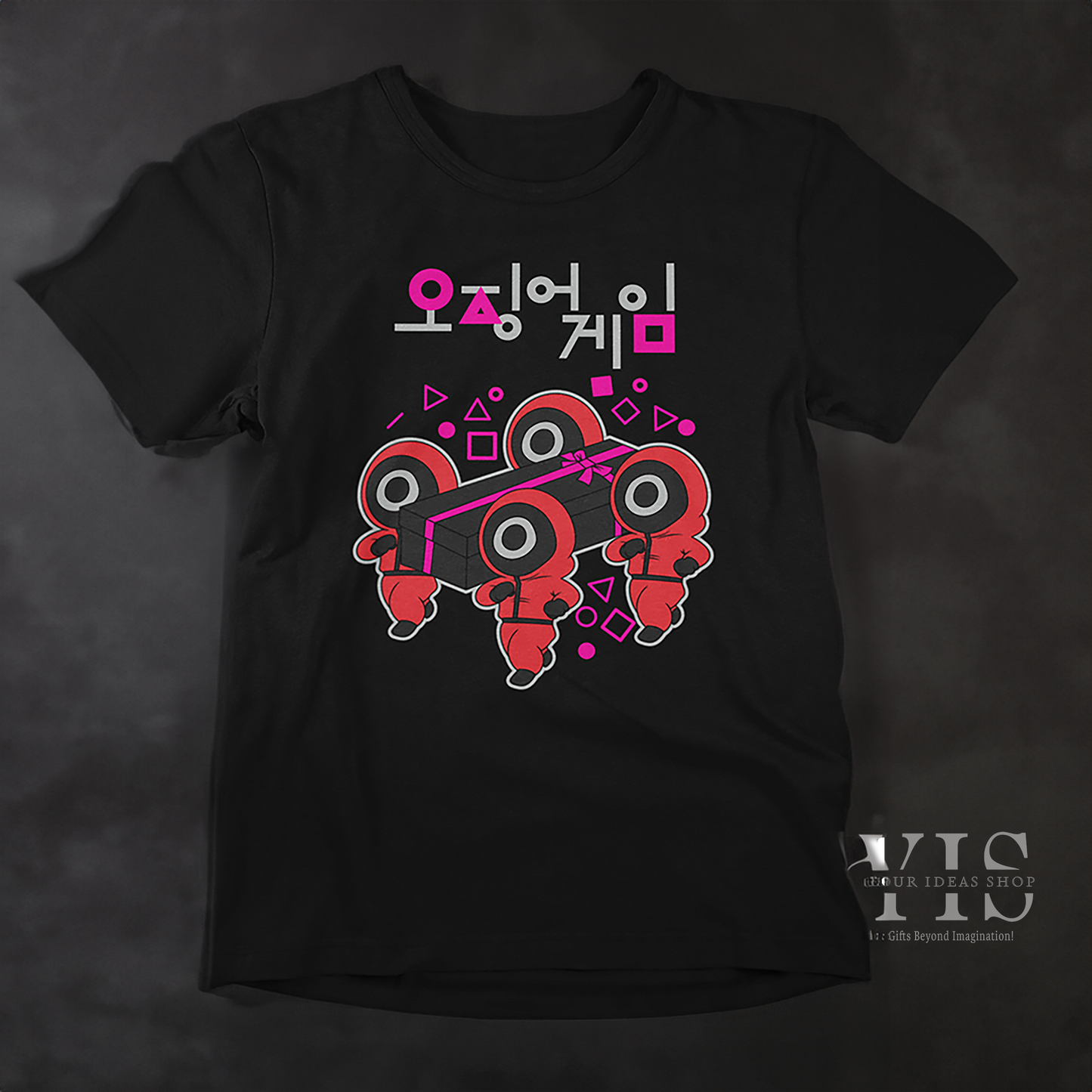 A black T-shirt featuring an artistic depiction of red-suited characters carrying a black gift box with a pink bow. The surrounding geometric shapes and Korean text enhance its modern and creative aesthetic. A great gift idea for fans of pop culture. Made by Your iDeas Shop.