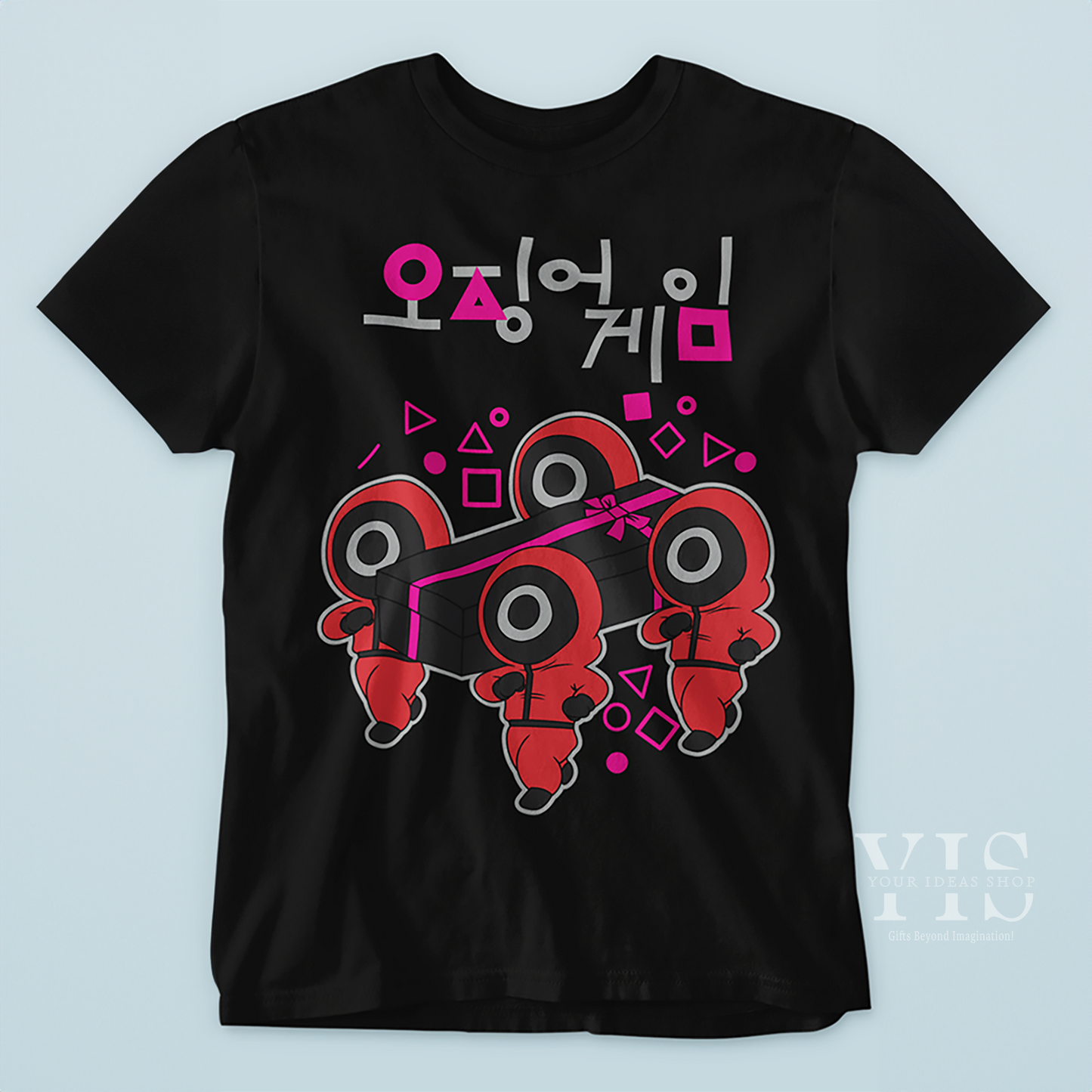 A black T-shirt showcasing a quirky graphic of red-suited figures lifting a black gift box tied with a pink ribbon. The design is accented with triangles, circles, and squares, along with Korean text. Perfect for fans of unique and bold apparel. Made by Your iDeas Shop.