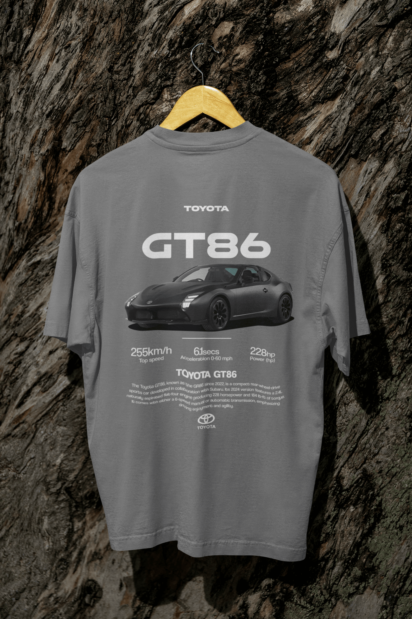 Back view of a person wearing a black Toyota GT86 Sports Car Graphic T-Shirt featuring specs and sleek car design.