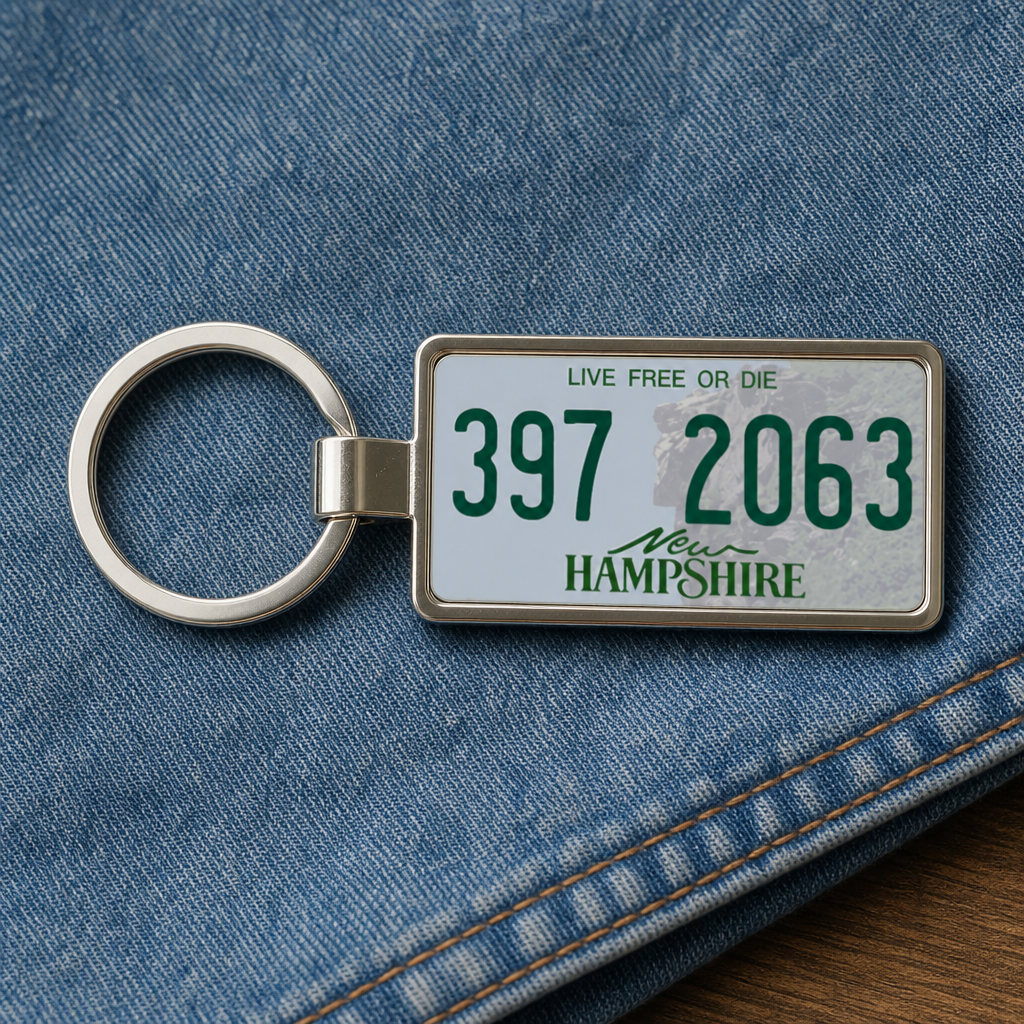 New Hampshire 397 2063 license plate keychain on_denim