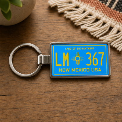 New Mexico LM 367 license plate keychain on_wood
