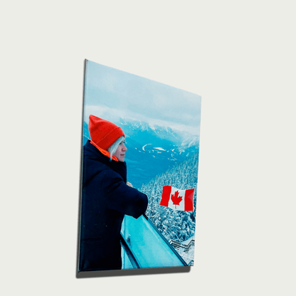 Custom photo magnet featuring a scenic winter view with a person wearing a bright orange hat and a Canadian flag.