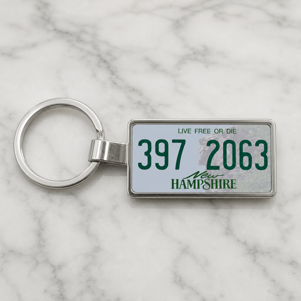 New Hampshire 397 2063 license plate keychain on_marble