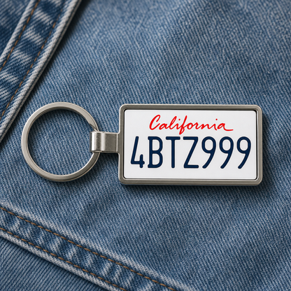 California 4BTZ999 license plate keychain on denim