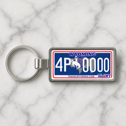 Wyoming license plate keychain on marble