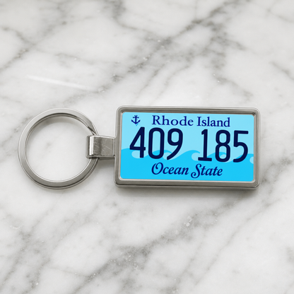 Rhode Island 409 185 license plate keychain on_marble