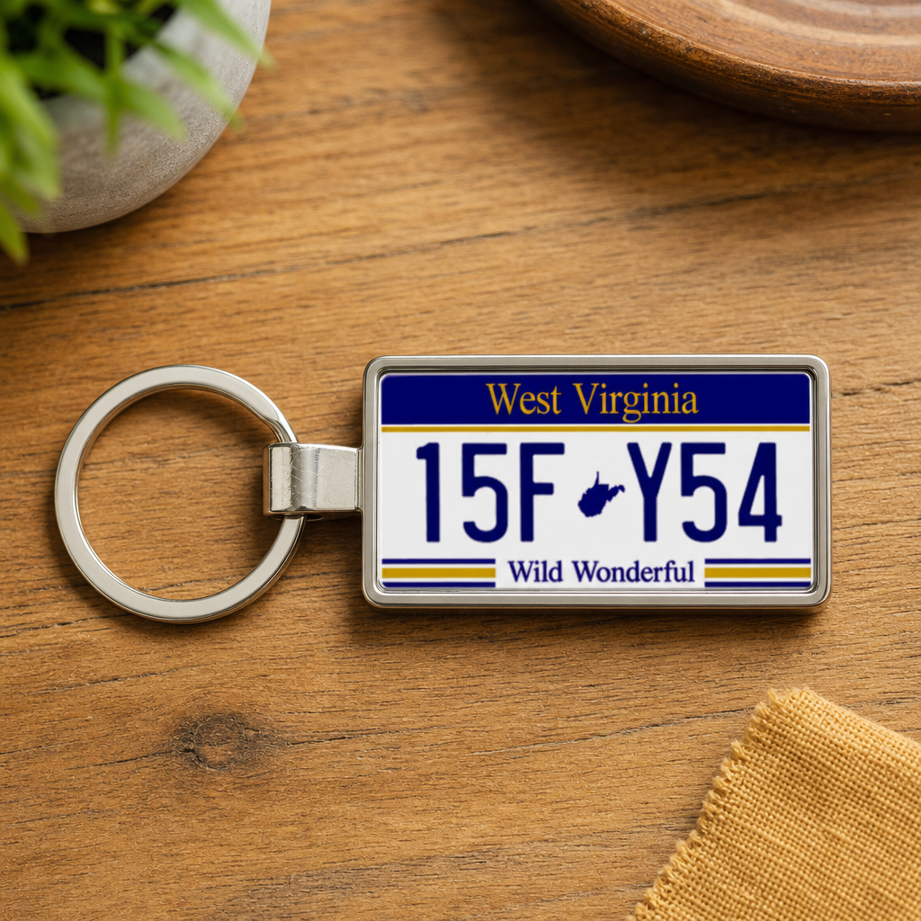 West Virginia license plate keychain on wooden table