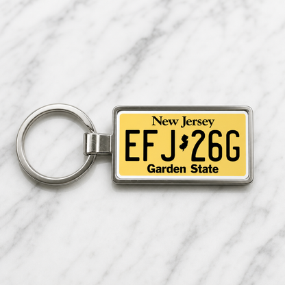 New Jersey EFJ 26G license plate keychain on_marble