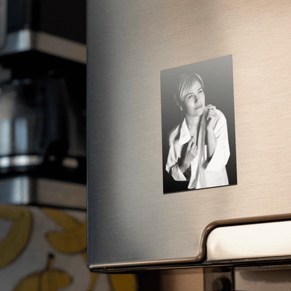 Custom photo magnet featuring a personal black and white picture on a fridge.