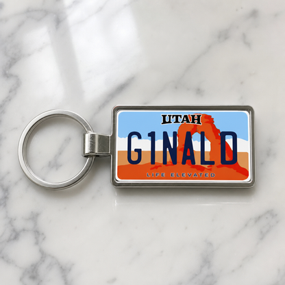 Utah license plate keychain on marble