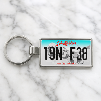 South Dakota license plate keychain on marble