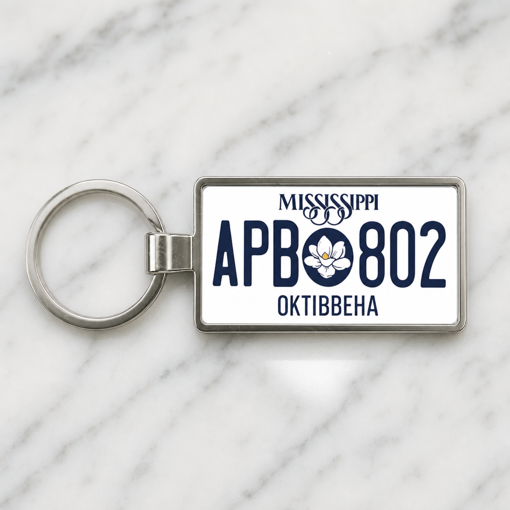 Mississippi APB 802 license plate keychain on_marble