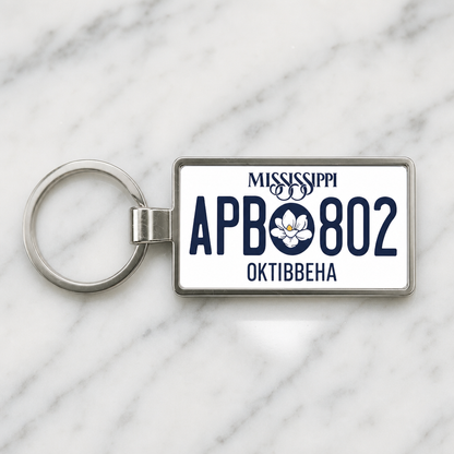 Mississippi APB 802 license plate keychain on_marble