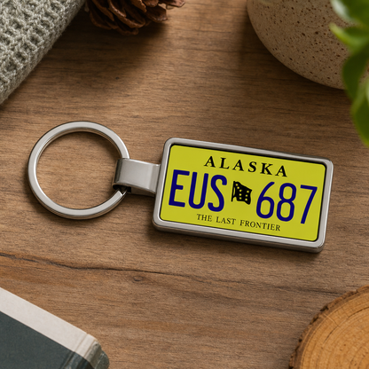 Alaska EUS 687 license plate keychain on_wood