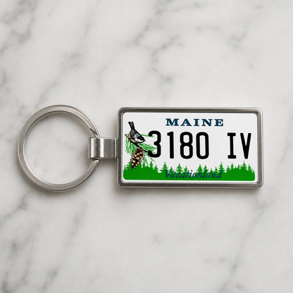 Maine 3180 IV license plate keychain on_marble