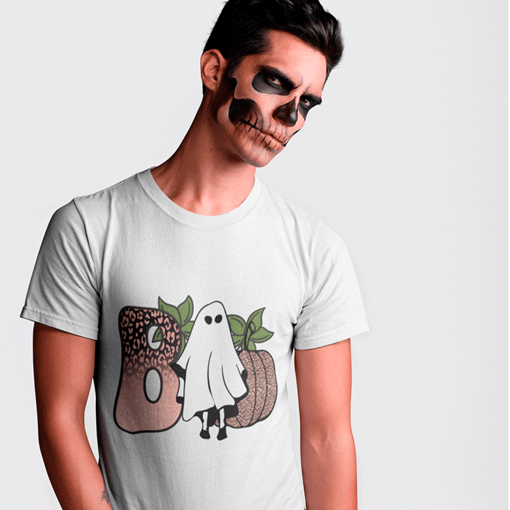 Person wearing a white t-shirt with Halloween-themed design on a plain background