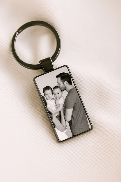 Custom keychain with a black and white photo of a father kissing a toddler while holding a second child, symbolizing love and family moments. Made by Your iDeas Shop.