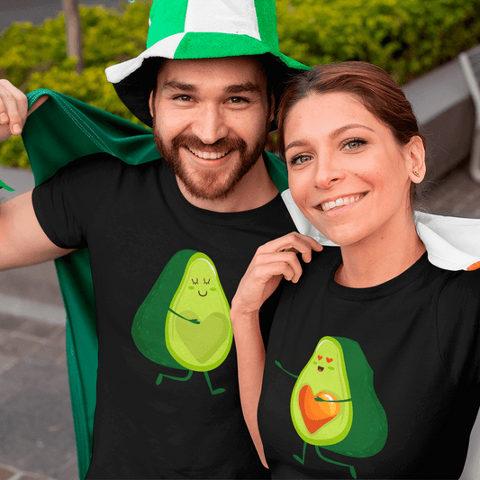 Two people wearing black t-shirts with avocado designs, one in a green and white hat.