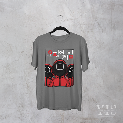 A gray T-shirt showcasing a clean and vibrant illustration of three guards dressed in red uniforms. Each guard has a unique geometric mask, complemented by bold Korean text above the design. A subtle and stylish choice for fans of modern pop culture. Made by Your iDeas Shop.