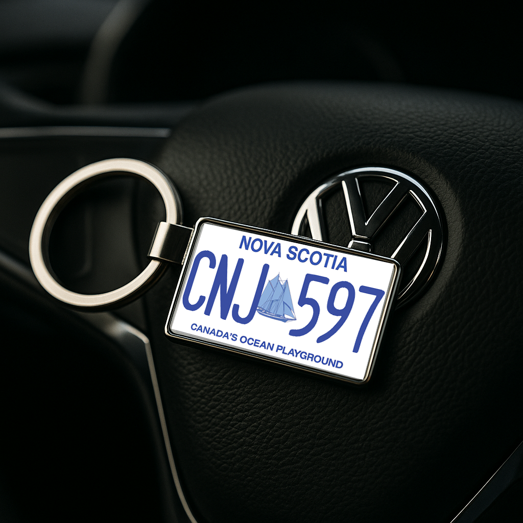 A keychain in the form of a Nova Scotia license plate with CNJ 597, positioned on a Volkswagen steering wheel, emphasizing its automotive appeal. Great for drivers and collectors. Made by Your iDeas Shop