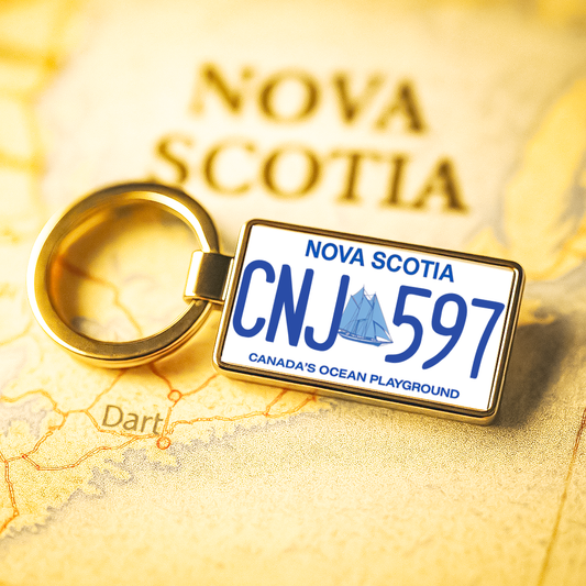 A Nova Scotia CNJ 597 license plate keychain placed on a vintage-style map highlighting Nova Scotia, perfect for those passionate about travel and Canadian provinces. Made by Your iDeas Shop.