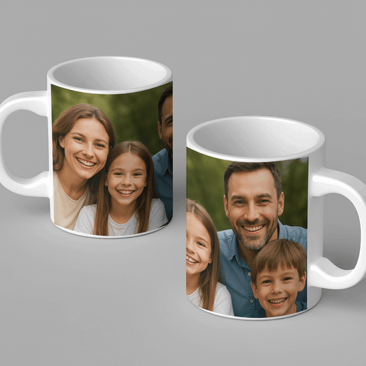 A white ceramic mug printed with a smiling family portrait featuring parents and two children. A perfect personalized gift for birthdays, anniversaries, or family celebrations. Made by Your iDeas Shop.