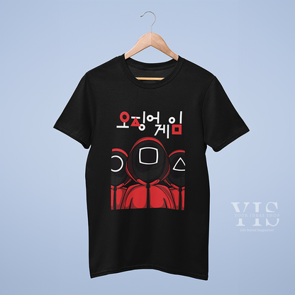 A black T-shirt on a hanger, featuring a bold design of three red guards with square, circle, and triangle masks. The layout is topped with striking Korean text, creating an eye-catching and trendy look. Perfect for casual wear or gifting. Made by Your iDeas Shop.