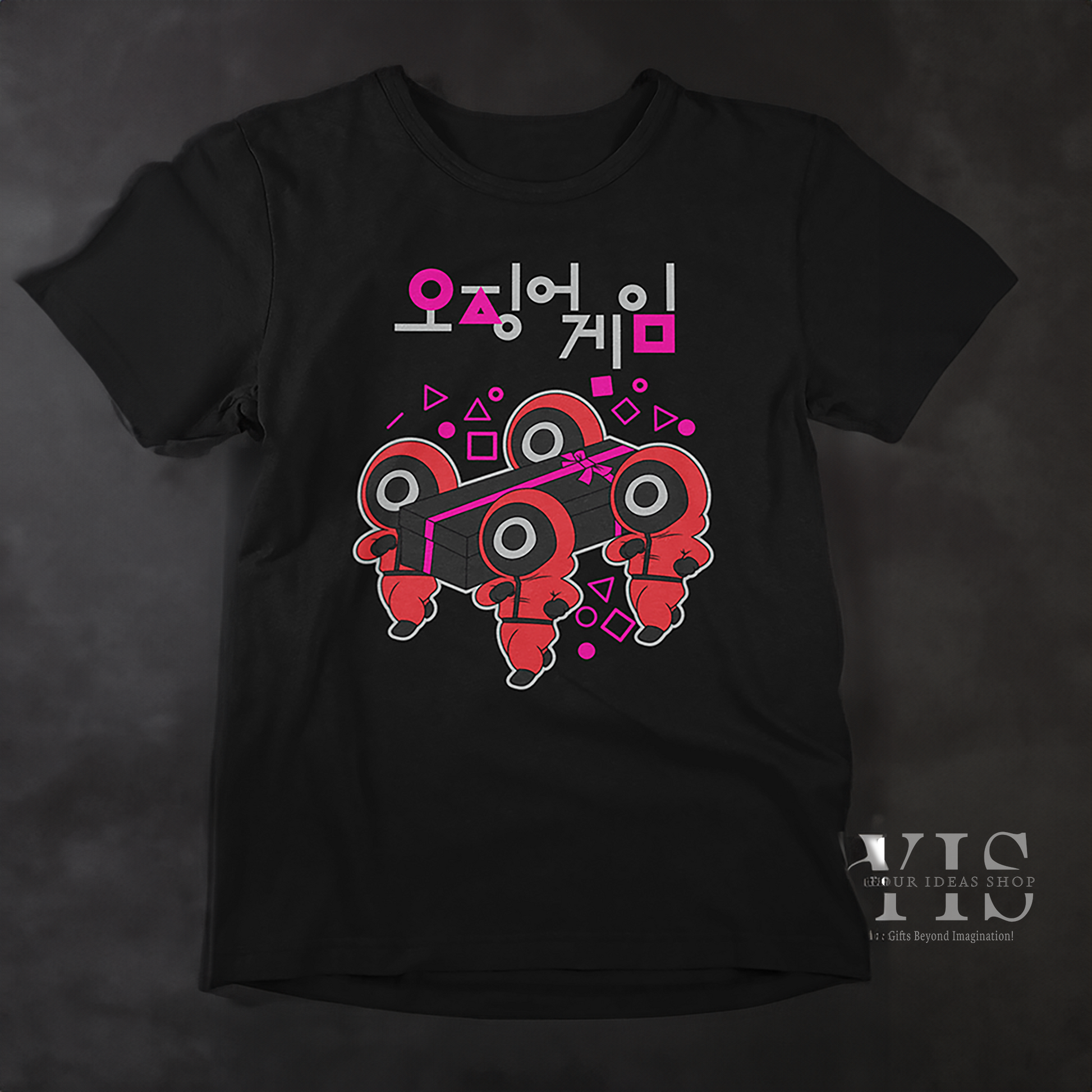 A black T-shirt featuring an artistic depiction of red-suited characters carrying a black gift box with a pink bow. The surrounding geometric shapes and Korean text enhance its modern and creative aesthetic. A great gift idea for fans of pop culture. Made by Your iDeas Shop.