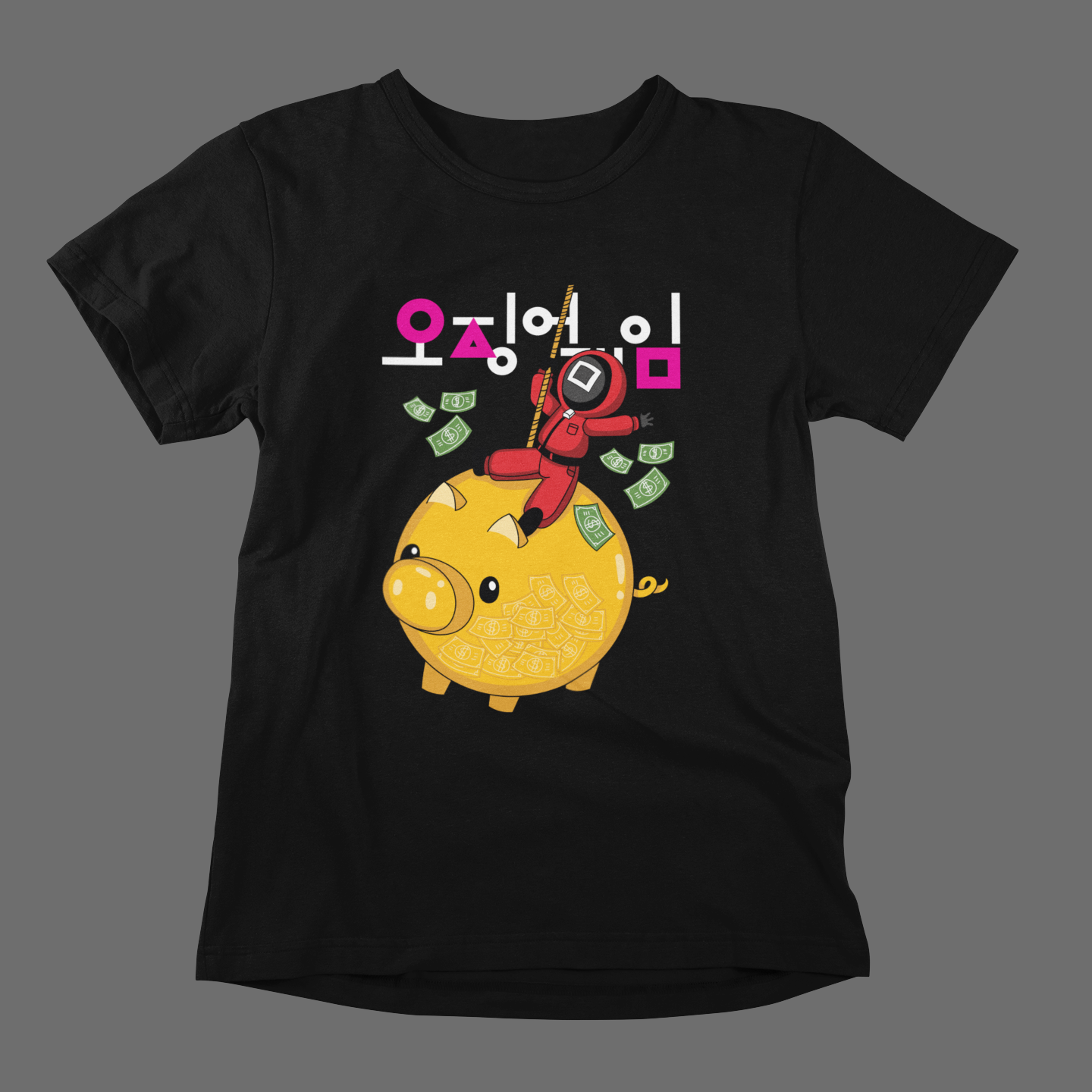 A trendy black T-shirt displaying a colorful graphic of a piggy bank stuffed with money. A bold red-suited character is scaling the piggy bank, accompanied by Korean text. A unique design for pop culture enthusiasts. Made by Your iDeas Shop.
