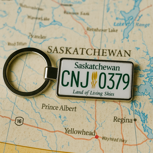 A Saskatchewan license plate keychain with CNJ 0379 and the phrase 'Land of Living Skies', placed on a map highlighting cities like Regina and Prince Albert. A meaningful travel keepsake from Canada. Made by Your iDeas Shop.