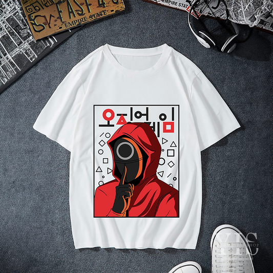 A white T-shirt featuring a bold graphic of a red-hooded Squid Game character with a circle mask, surrounded by geometric shapes and Korean text. A trendy design inspired by the popular TV series. Made by Your iDeas Shop