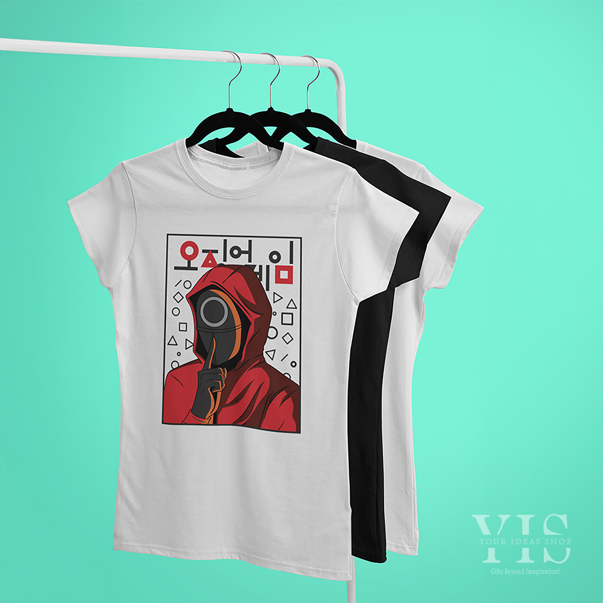 A set of T-shirts on hangers, with the front T-shirt featuring a Squid Game-inspired red-hooded character design with a circle mask, geometric shapes, and Korean text. Displayed on a rack against a mint-green background. Made by Your iDeas Shop.