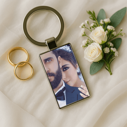 Custom keychain displaying a close-up wedding portrait beside gold rings and white roses, perfect for celebrating marriage. Made by Your iDeas Shop.