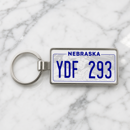 Nebraska YDF 293 license plate keychain on_marble