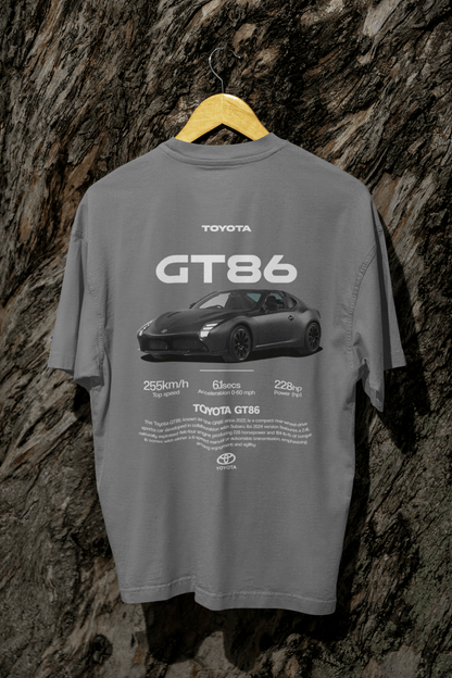 Back view of a person wearing a black Toyota GT86 Sports Car Graphic T-Shirt featuring specs and sleek car design.
