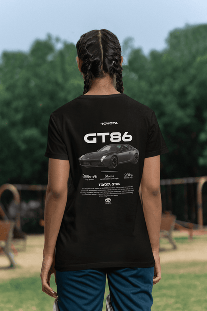 Back view of a person wearing a black Toyota GT86 Sports Car Graphic T-Shirt featuring specs and sleek car design.