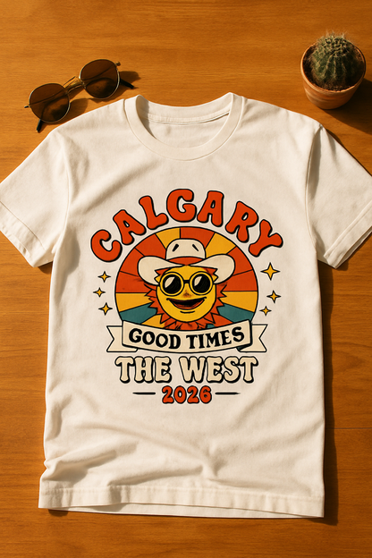 Calgary Good Times 2026 white t-shirt flat-lay on warm wood with retro sunglasses and a cactus
