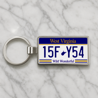 West Virginia license plate keychain on marble