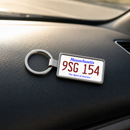 Massachusetts 9SG 154 license plate keychain on_dashboard
