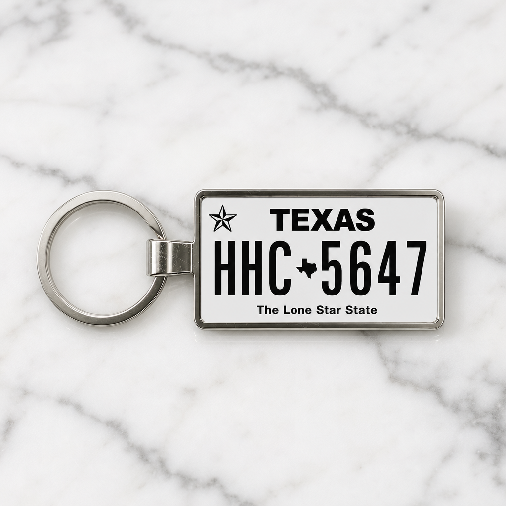 Texas license plate keychain on marble