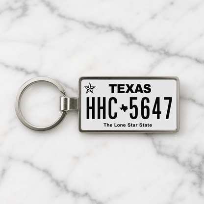 Texas license plate keychain on marble