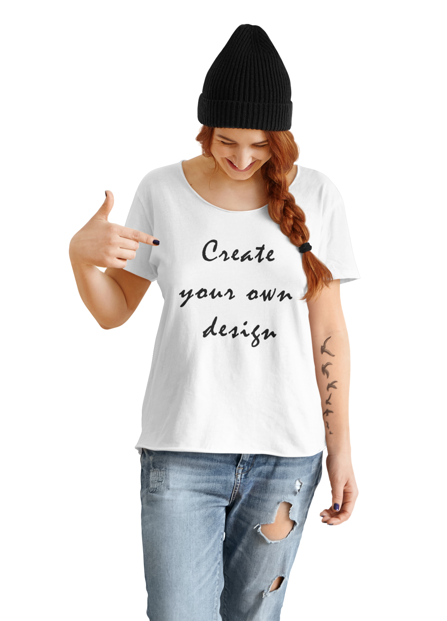 A tattooed woman wearing a black beanie and distressed jeans points to her white t-shirt featuring the text "Create your own design." This stylish and creative design is perfect for those looking to express their individuality through fashion.