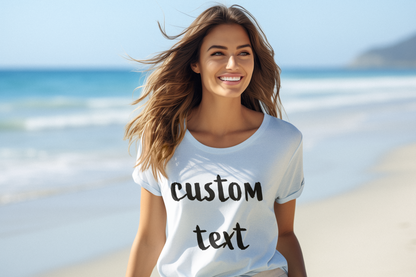 Smiling woman wearing a custom t-shirt with personalized text while standing on a beach