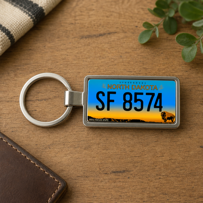 North Dakota SF 8574 license plate keychain on_wood
