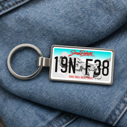 South Dakota license plate keychain on denim